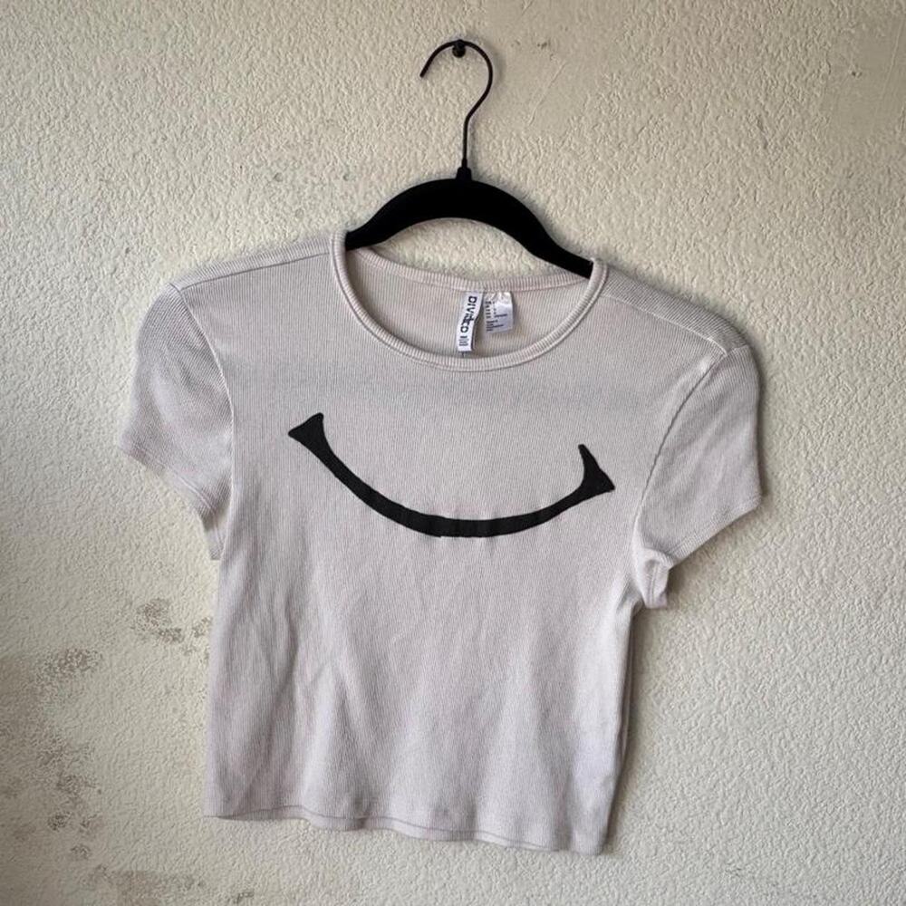 Womens white tee featuring 'smiley' print
